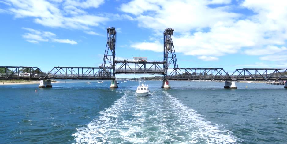 A boat cruising under the Bateman's Bay Bridge